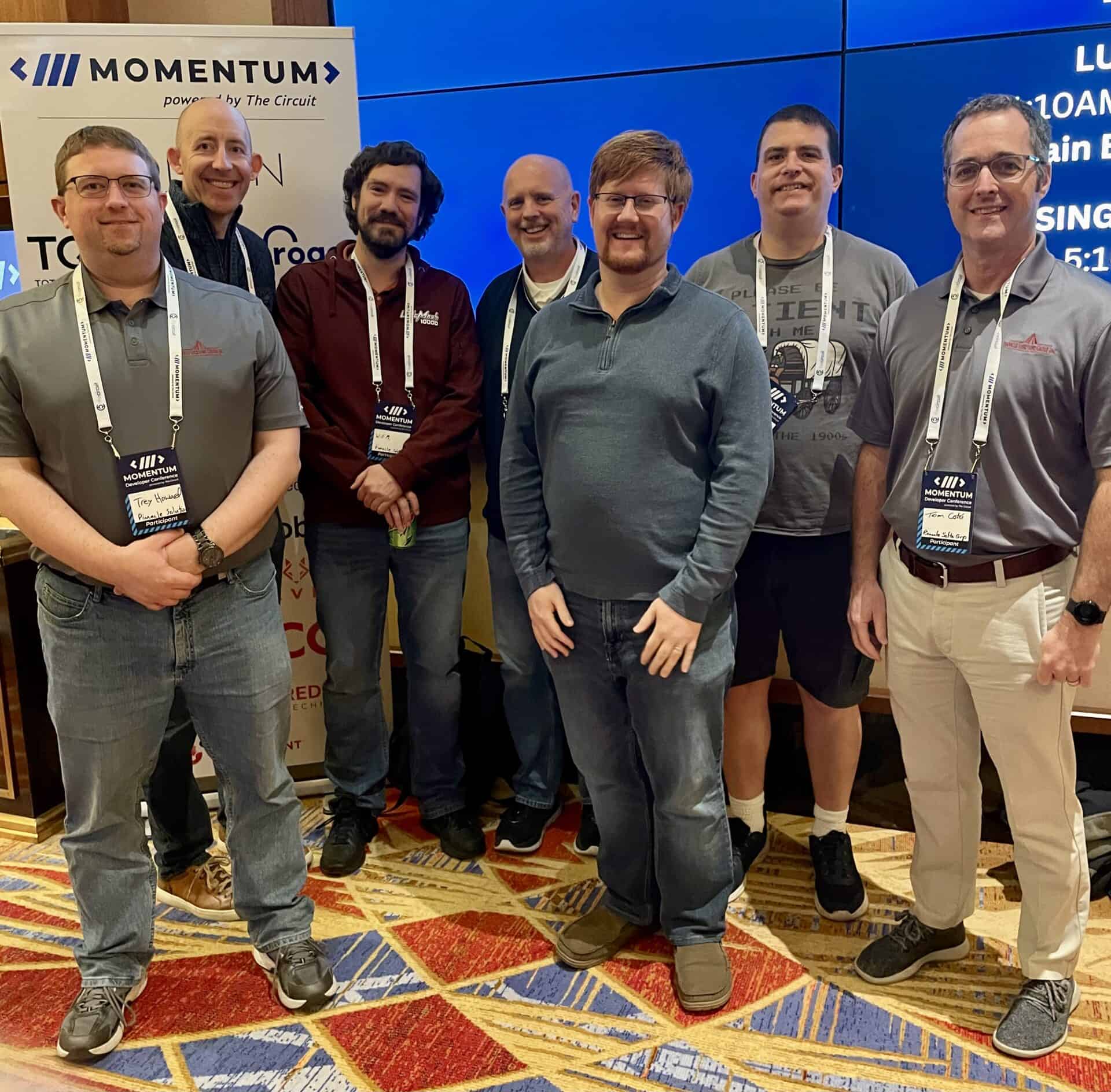 Pinnacle employees Trey Howard, Jay Larbes, Will Morrison, Steve Brettschneider, Corey Barnett, Dan Miller and Tom Cote at Momentum Developer Conference 2024